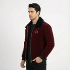Side view of men's maroon velvet winter jacket featuring a black faux fur collar and gold "D" logo on the chest.