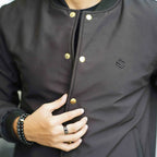 Men’s black softshell bomber jacket with front button closure – winter outerwear by Coder Stitch