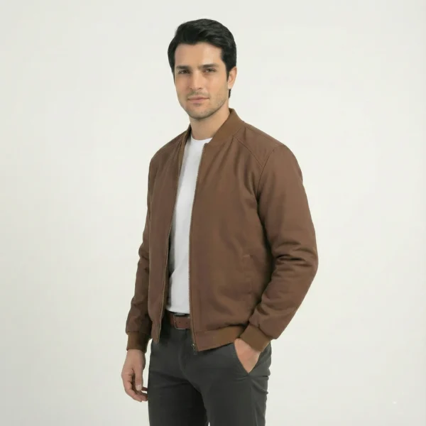 Side angle view of men's brown softshell bomber jacket worn open, showing fit and sleeve length.