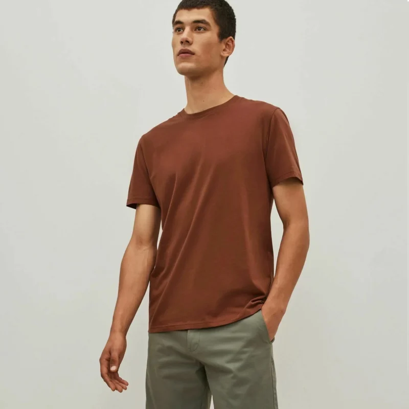 Man wearing a plain brown cotton T-shirt with round neck – front view
